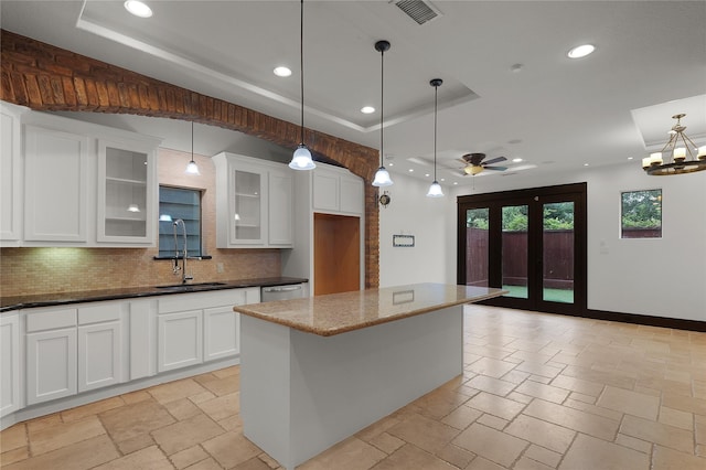 406 Fenn St Unit B, Houston, TX 77018 - kitchen with a sink, tasteful backsplash, recessed lighting, stone tile flooring, and a tray ceiling
