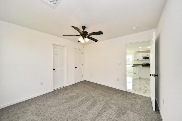 80 Rd 5608, Cleveland, TX 77327 - unfurnished bedroom with carpet floors, baseboards, and ceiling fan