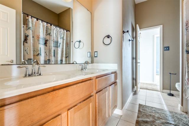 2803 Youpon Glen Way, Fresno, TX 77545 - bathroom featuring tile patterned floors, double vanity, toilet, and baseboards