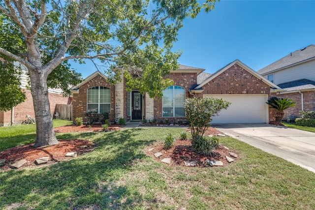 2803 Youpon Glen Way, Fresno, TX 77545 - traditional-style home featuring a garage, driveway, a front yard, and brick siding