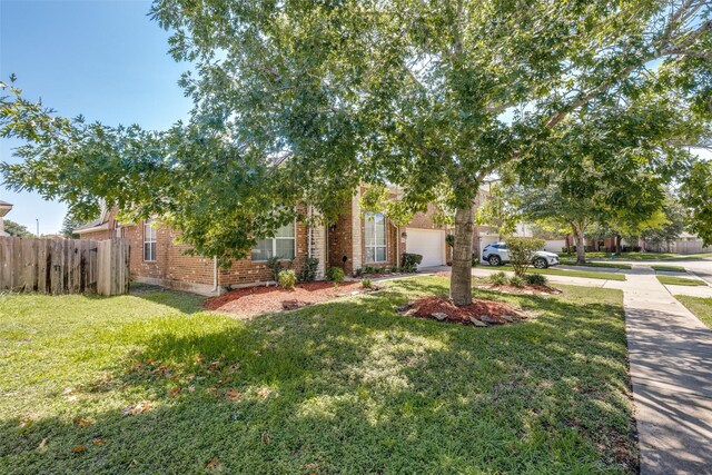 2803 Youpon Glen Way, Fresno, TX 77545 - obstructed view of property with driveway, brick siding, and an attached garage