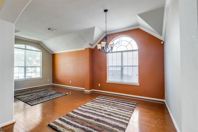 2803 Youpon Glen Way, Fresno, TX 77545 - unfurnished dining area with lofted ceiling, a chandelier, plenty of natural light, and wood finished floors