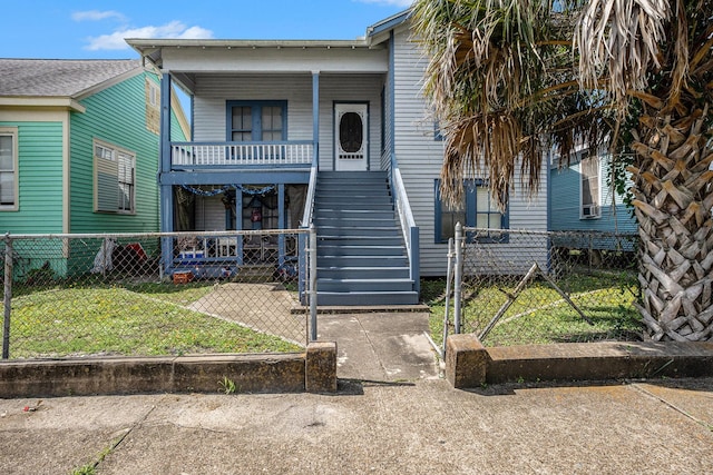 3309 Avenue N, Galveston, TX 77550 - view of front of house featuring covered porch, stairs, and a fenced front yard