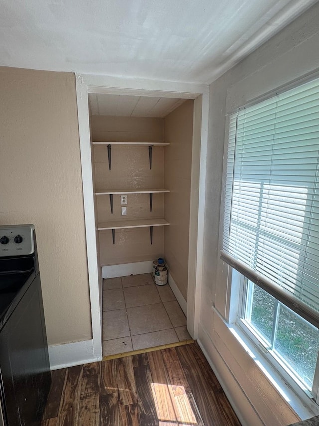3309 Avenue N, Galveston, TX 77550 - laundry room featuring washer / clothes dryer and wood finished floors