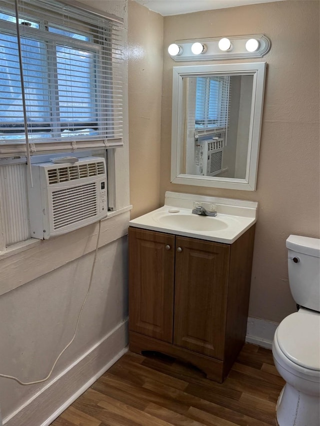 3309 Avenue N, Galveston, TX 77550 - bathroom with wood finished floors, vanity, and cooling unit