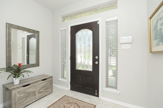 24710 Royal Pike Dr, Katy, TX 77493 - foyer with light tile patterned floors and baseboards