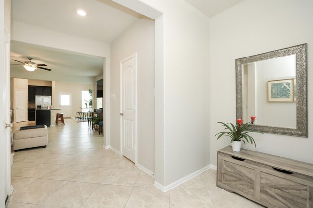 24710 Royal Pike Dr, Katy, TX 77493 - hallway featuring light tile patterned flooring, baseboards, and recessed lighting