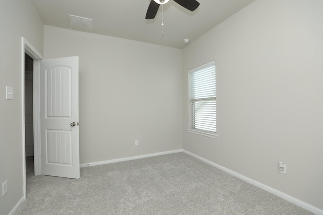 24710 Royal Pike Dr, Katy, TX 77493 - empty room featuring light colored carpet, ceiling fan, and baseboards