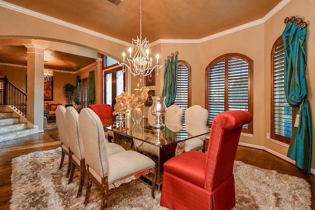 902 Delford Way, Sugar Land, TX 77479 - dining room with arched walkways, wood finished floors, a chandelier, decorative columns, and ornamental molding