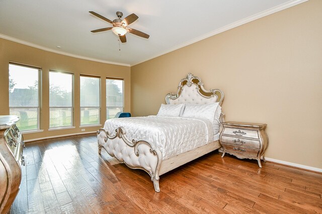 902 Delford Way, Sugar Land, TX 77479 - bedroom featuring ornamental molding, wood finished floors, baseboards, and ceiling fan