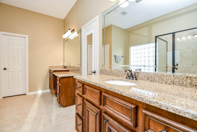 902 Delford Way, Sugar Land, TX 77479 - bathroom with two vanities, tile patterned flooring, and a shower stall