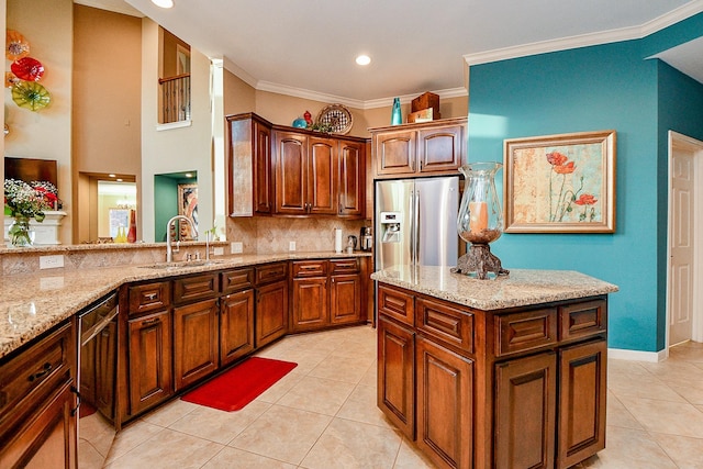 902 Delford Way, Sugar Land, TX 77479 - kitchen featuring stainless steel fridge, a sink, light tile patterned floors, light stone countertops, and ornamental molding