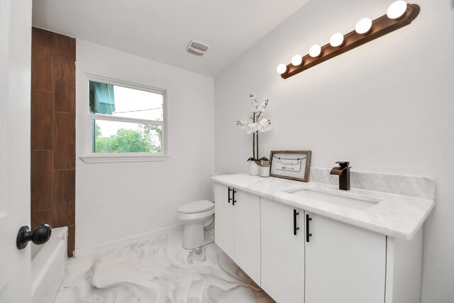 5419 N Crooked Creek Dr, Houston, TX 77017 - bathroom with vanity, toilet, baseboards, marble look tiles, and shower / washtub combination