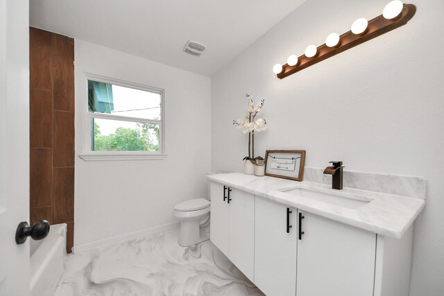 5419 N Crooked Creek Dr, Houston, TX 77017 - bathroom featuring vanity, toilet, baseboards, and marble finish floors
