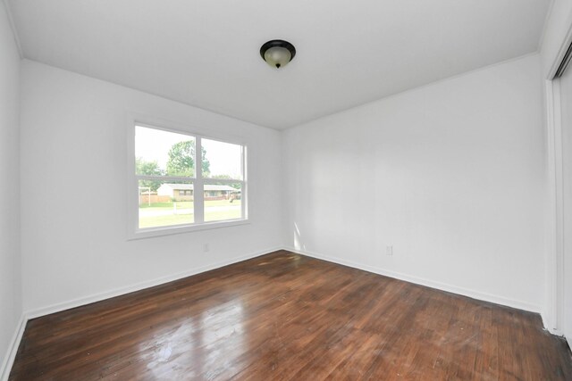 5419 N Crooked Creek Dr, Houston, TX 77017 - empty room featuring dark wood-type flooring and baseboards