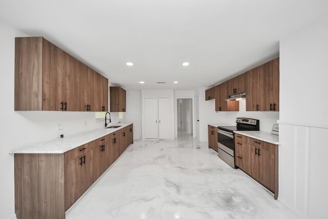 5419 N Crooked Creek Dr, Houston, TX 77017 - kitchen featuring stainless steel range with electric cooktop, under cabinet range hood, light marble finish flooring, recessed lighting, and light countertops