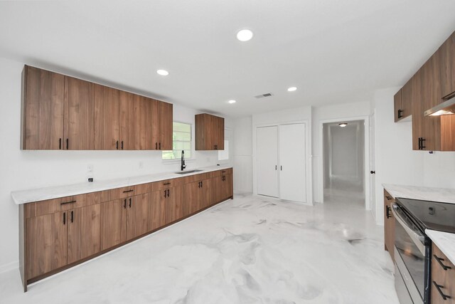 5419 N Crooked Creek Dr, Houston, TX 77017 - kitchen featuring a sink, electric stove, light marble finish flooring, recessed lighting, and brown cabinets