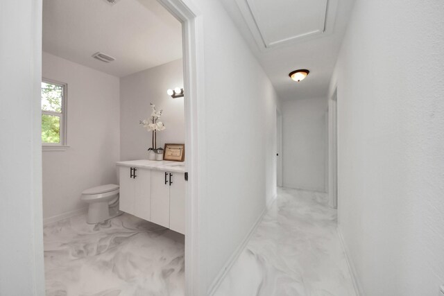 5419 N Crooked Creek Dr, Houston, TX 77017 - bathroom with marble finish floors, toilet, vanity, and baseboards