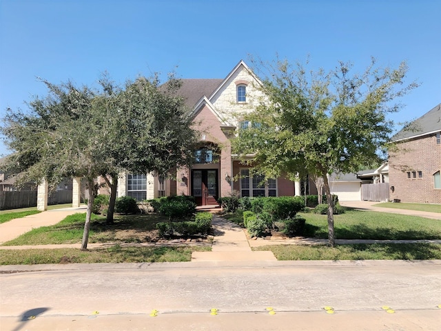 3003 Mystic Frst, Missouri City, TX 77459 - view of front of home with french doors and concrete driveway