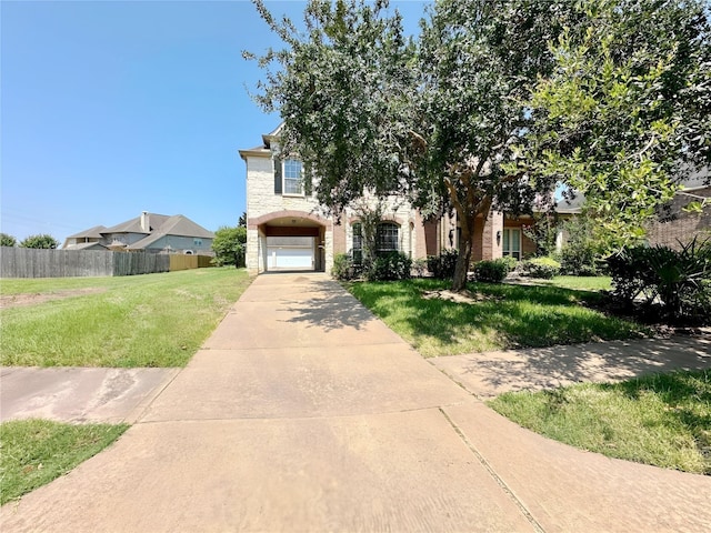 3003 Mystic Frst, Missouri City, TX 77459 - view of property hidden behind natural elements with concrete driveway, stone siding, and an attached garage
