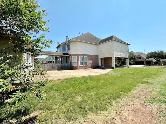 3003 Mystic Frst, Missouri City, TX 77459 - back of house with brick siding, a patio, and a chimney
