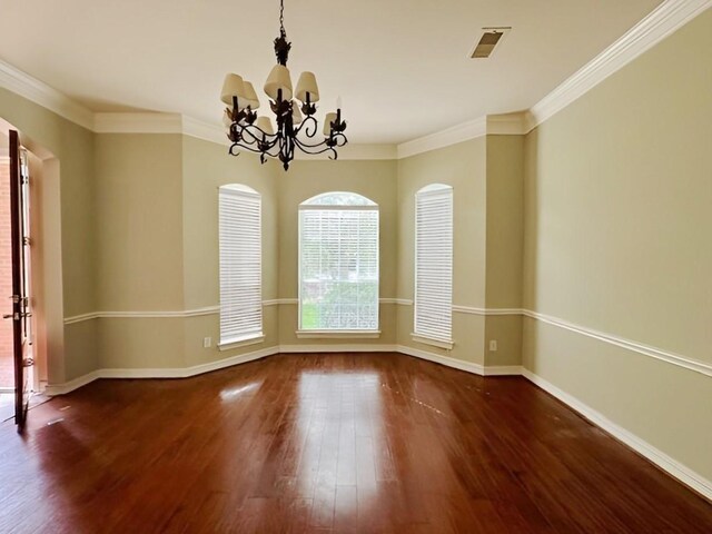 3003 Mystic Frst, Missouri City, TX 77459 - unfurnished room with wood finished floors, a chandelier, arched walkways, baseboards, and crown molding