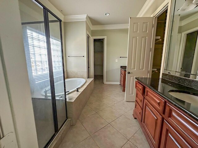 3003 Mystic Frst, Missouri City, TX 77459 - bathroom featuring vanity, ornamental molding, a garden tub, tile patterned flooring, and a stall shower