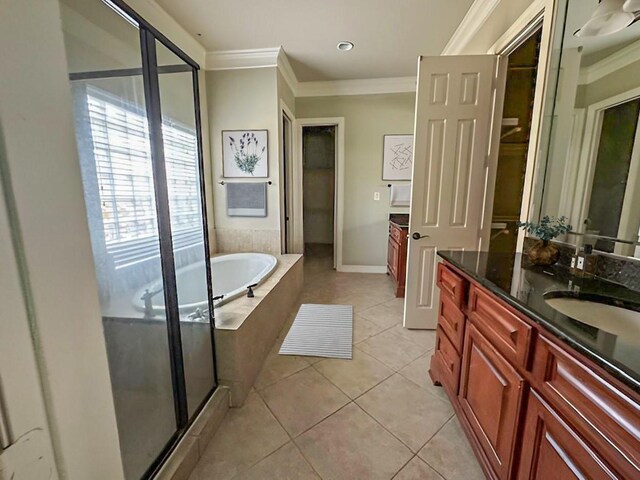 3003 Mystic Frst, Missouri City, TX 77459 - full bathroom featuring crown molding, vanity, tile patterned flooring, a bath, and a stall shower