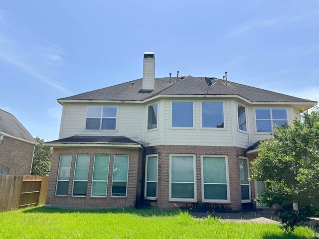 3003 Mystic Frst, Missouri City, TX 77459 - back of house with a chimney and brick siding