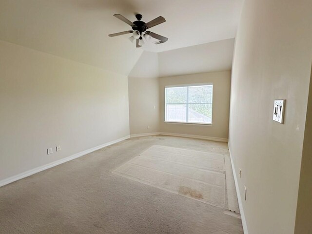 3003 Mystic Frst, Missouri City, TX 77459 - spare room with light colored carpet, ceiling fan, baseboards, and lofted ceiling