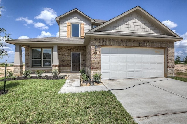 21323 Cypress Red Oak Dr, Cypress, TX 77433 - view of front facade with brick siding, concrete driveway, a front lawn, a garage, and roof with shingles