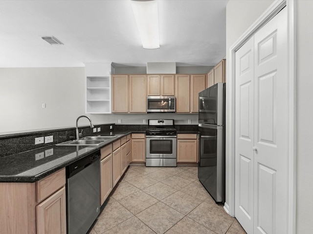 2234 Naomi St, Houston, TX 77054 - kitchen featuring appliances with stainless steel finishes, a sink, light brown cabinetry, and open shelves