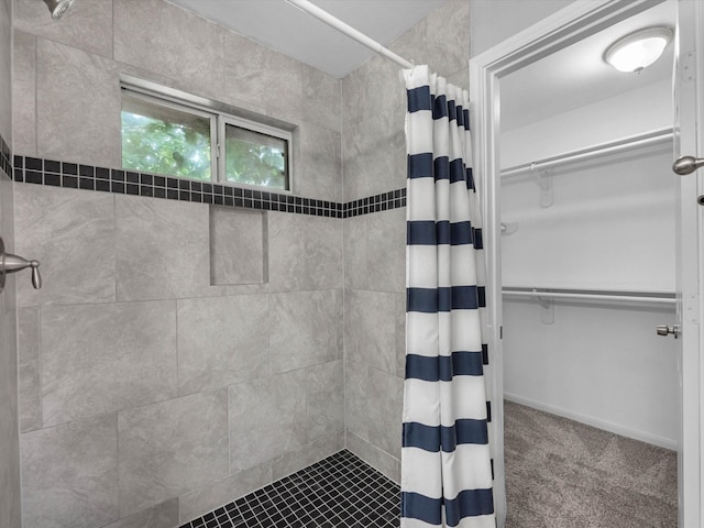 2234 Naomi St, Houston, TX 77054 - bathroom featuring a tile shower and a walk in closet