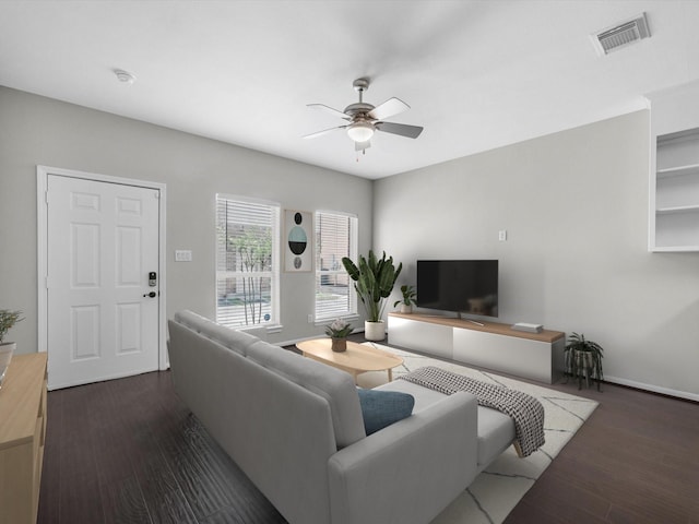 2234 Naomi St, Houston, TX 77054 - living area featuring ceiling fan, dark wood-style floors, and baseboards