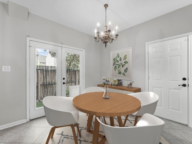 2234 Naomi St, Houston, TX 77054 - dining space featuring a chandelier, baseboards, french doors, and light tile patterned flooring