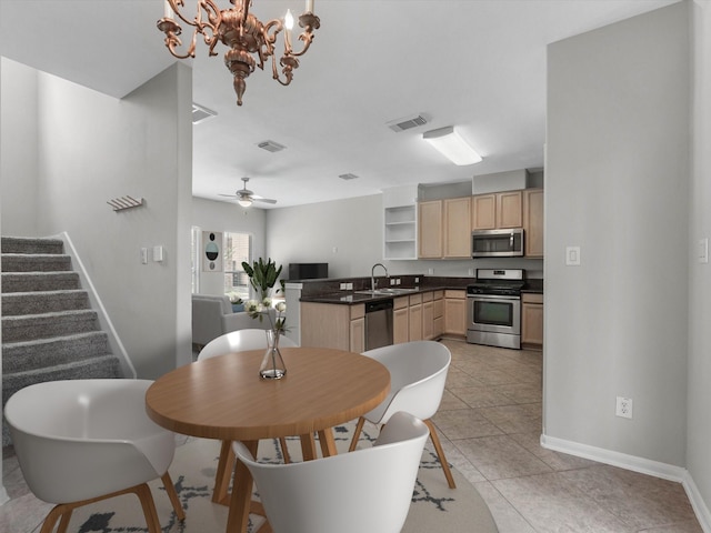 2234 Naomi St, Houston, TX 77054 - dining room featuring baseboards, a chandelier, stairs, light tile patterned flooring, and ceiling fan