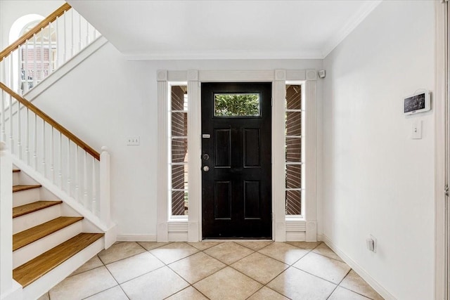 2263 Austin St, Houston, TX 77002 - tiled foyer featuring stairs, crown molding, and baseboards