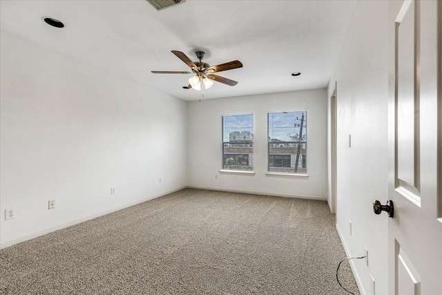 2263 Austin St, Houston, TX 77002 - empty room with light carpet, ceiling fan, and baseboards