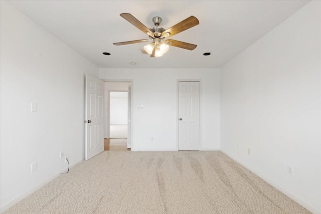 2263 Austin St, Houston, TX 77002 - unfurnished bedroom with light colored carpet, baseboards, and ceiling fan