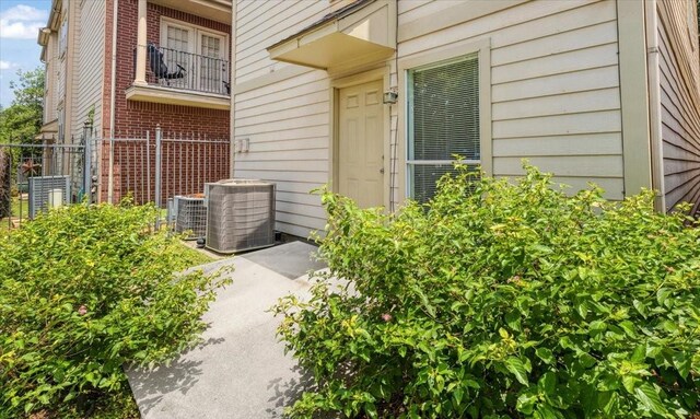 2263 Austin St, Houston, TX 77002 - view of exterior entry featuring central AC and brick siding
