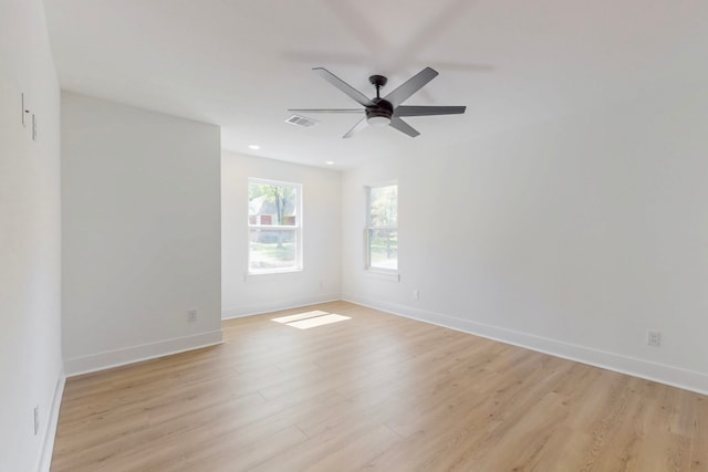 176 Kaelepulu Dr, Bastrop, TX 78602 - unfurnished room with light wood-type flooring, ceiling fan, baseboards, and recessed lighting