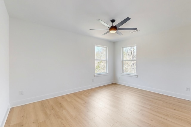 176 Kaelepulu Dr, Bastrop, TX 78602 - empty room featuring light wood-style flooring, a ceiling fan, and baseboards