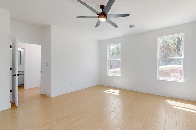 176 Kaelepulu Dr, Bastrop, TX 78602 - unfurnished room featuring a ceiling fan, light wood-type flooring, and baseboards