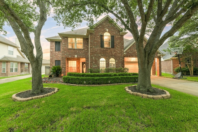 13814 Swan Hollow Ln, Houston, TX 77041 - georgian-style home with brick siding, driveway, and a front yard