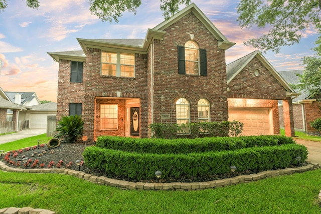 13814 Swan Hollow Ln, Houston, TX 77041 - view of front of house featuring brick siding, an attached garage, concrete driveway, and a front yard