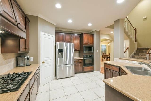 13814 Swan Hollow Ln, Houston, TX 77041 - kitchen with black appliances, arched walkways, a sink, backsplash, and ornamental molding
