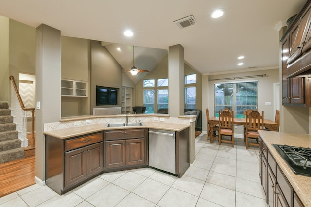 13814 Swan Hollow Ln, Houston, TX 77041 - kitchen with stainless steel dishwasher, black gas stovetop, a sink, dark brown cabinetry, and recessed lighting