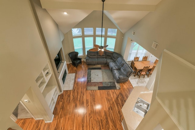 13814 Swan Hollow Ln, Houston, TX 77041 - living room featuring wood finished floors and high vaulted ceiling