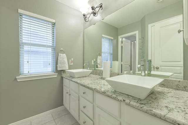 13814 Swan Hollow Ln, Houston, TX 77041 - full bathroom featuring plenty of natural light, double vanity, tile patterned floors, and baseboards