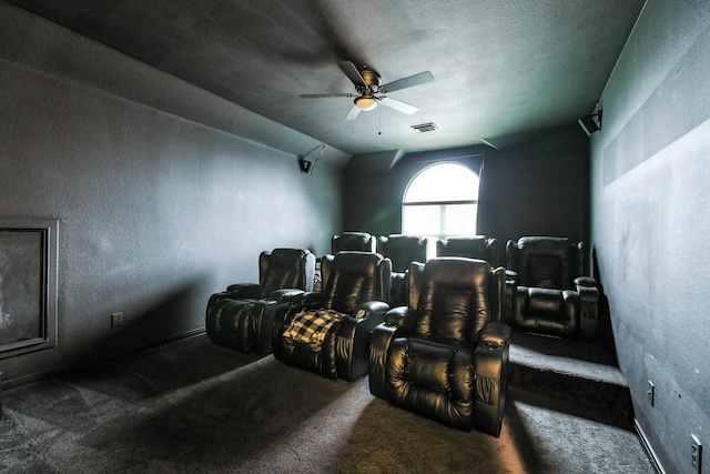 13814 Swan Hollow Ln, Houston, TX 77041 - home theater room featuring carpet flooring, ceiling fan, vaulted ceiling, baseboards, and a textured wall
